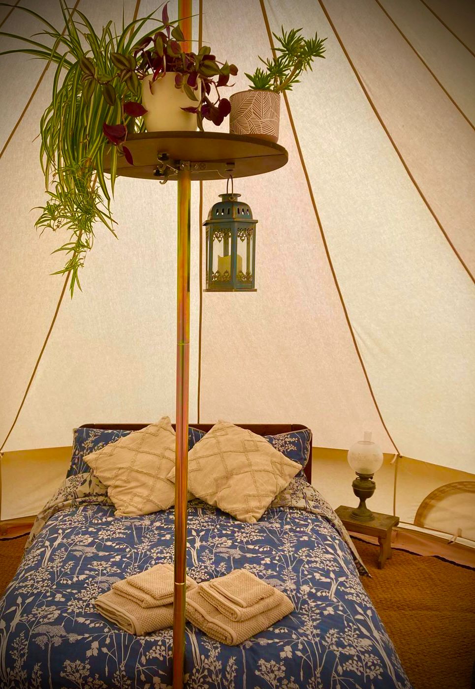 Luxury bell tent interior with cosy bedding